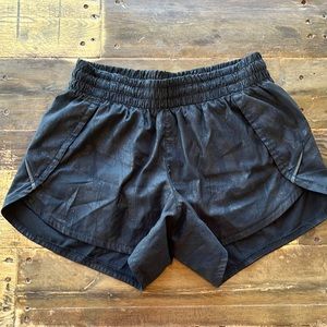 Athleta Size XS racer run short in black camo.